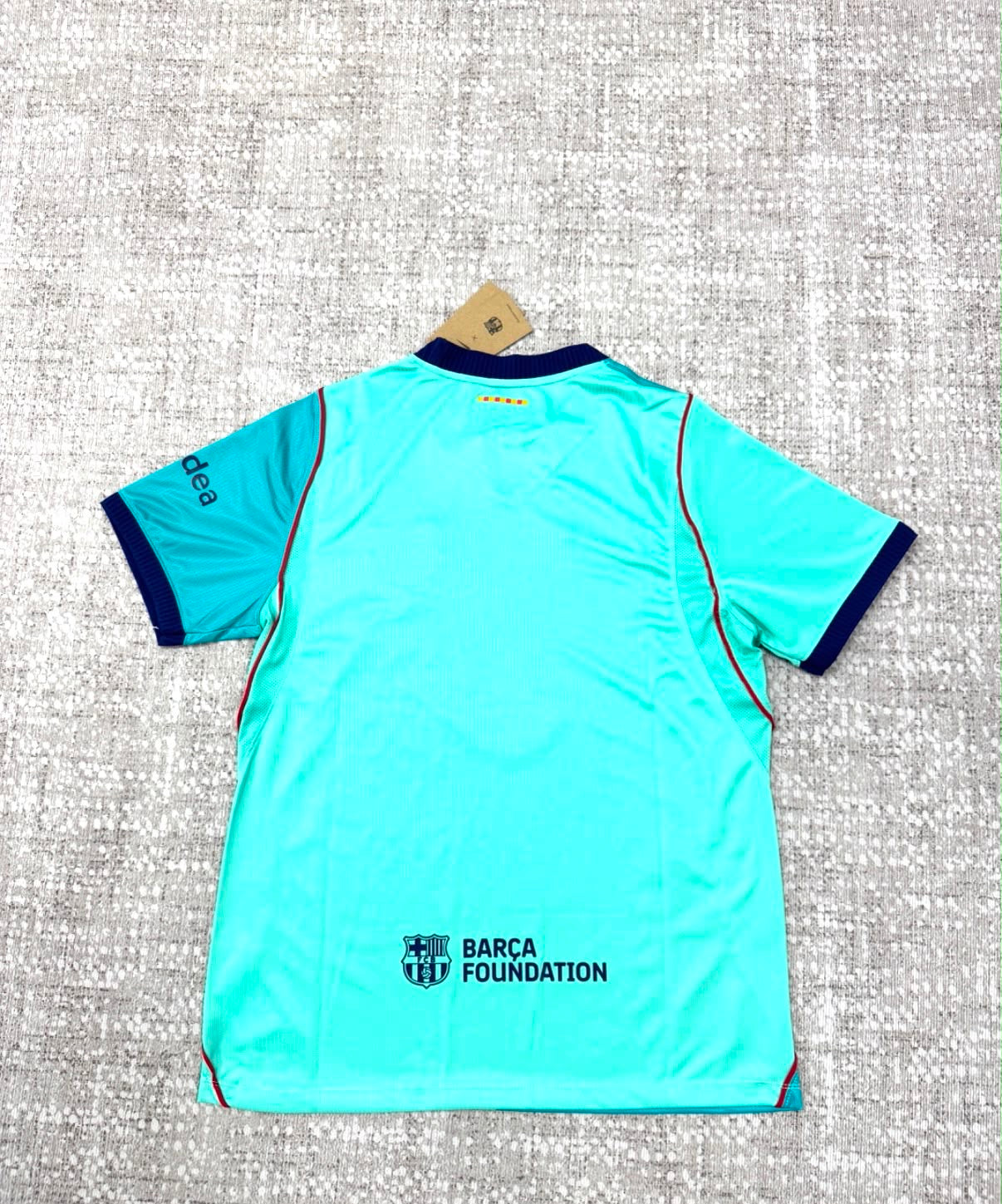 Maillot Third FC Barcelona 2026/27 turquoise vue de dos avec Barça Foundation