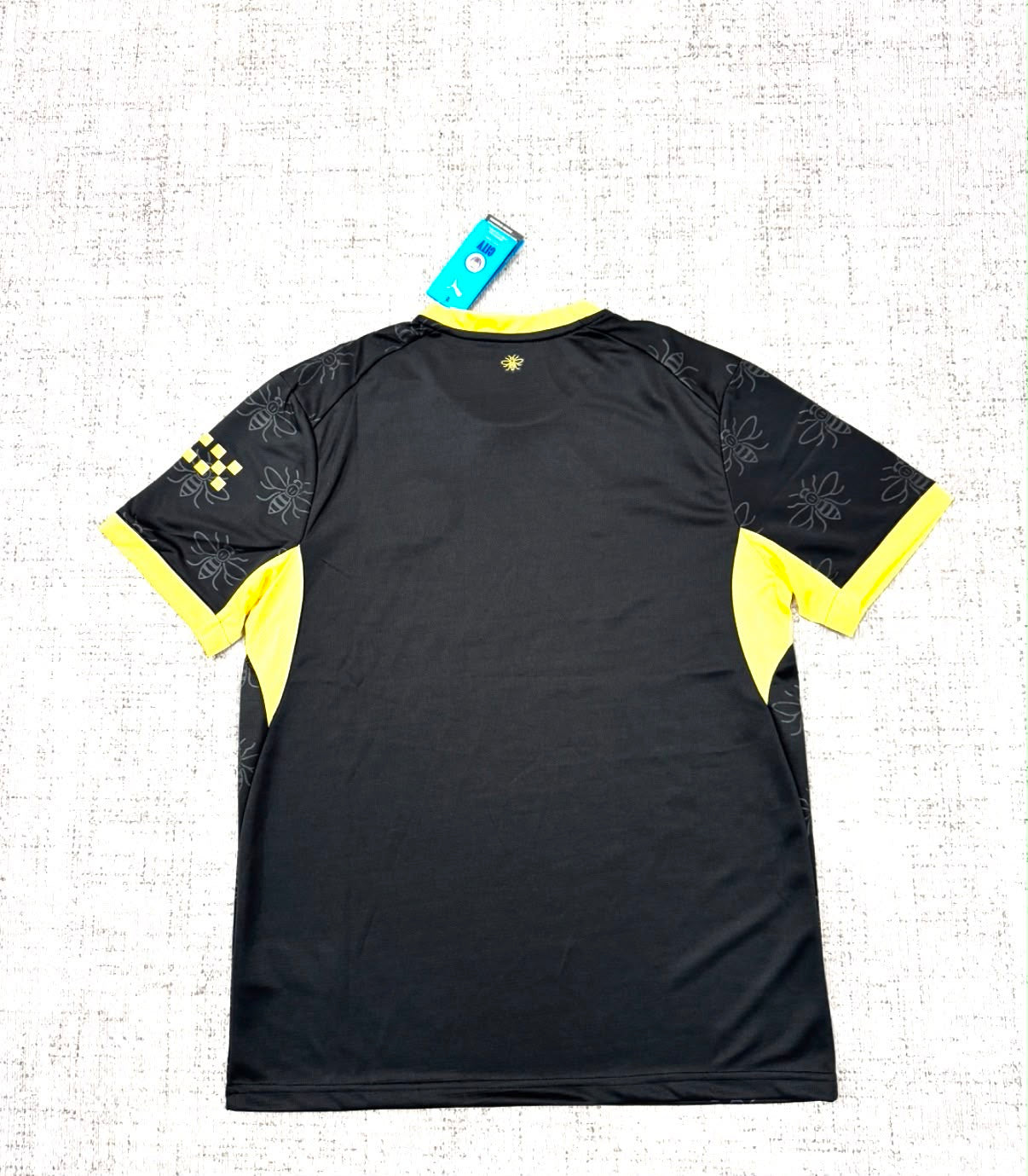 Maillot extérieur Manchester City 2026/27 noir et jaune vue de dos