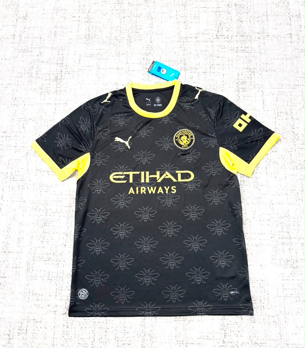 Maillot extérieur Manchester City 2026/27 noir et jaune vue de face