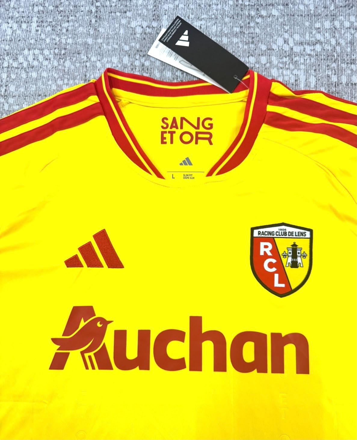 Maillot domicile RC Lens 2026/27 jaune et rouge - détail